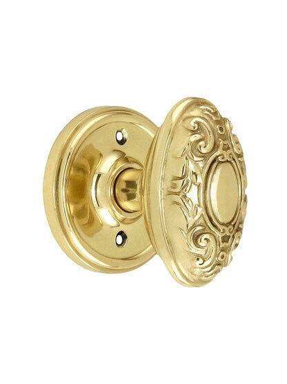 Classic Rosette Door Set With Decorative Oval Knobs Single Dummy in Polished Brass.